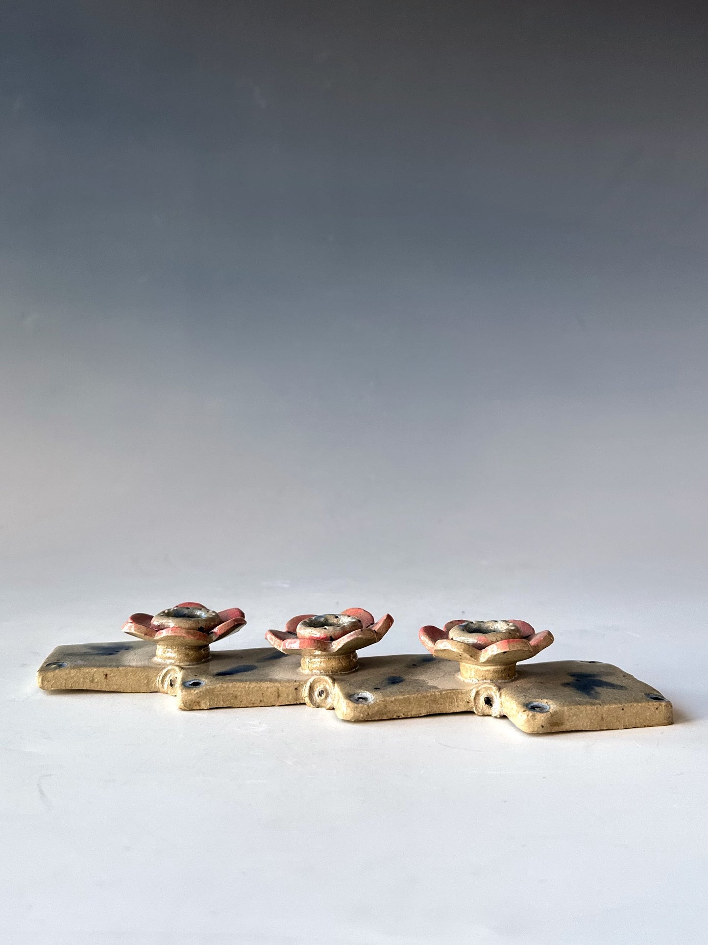 Row of Flowers Candle Holder