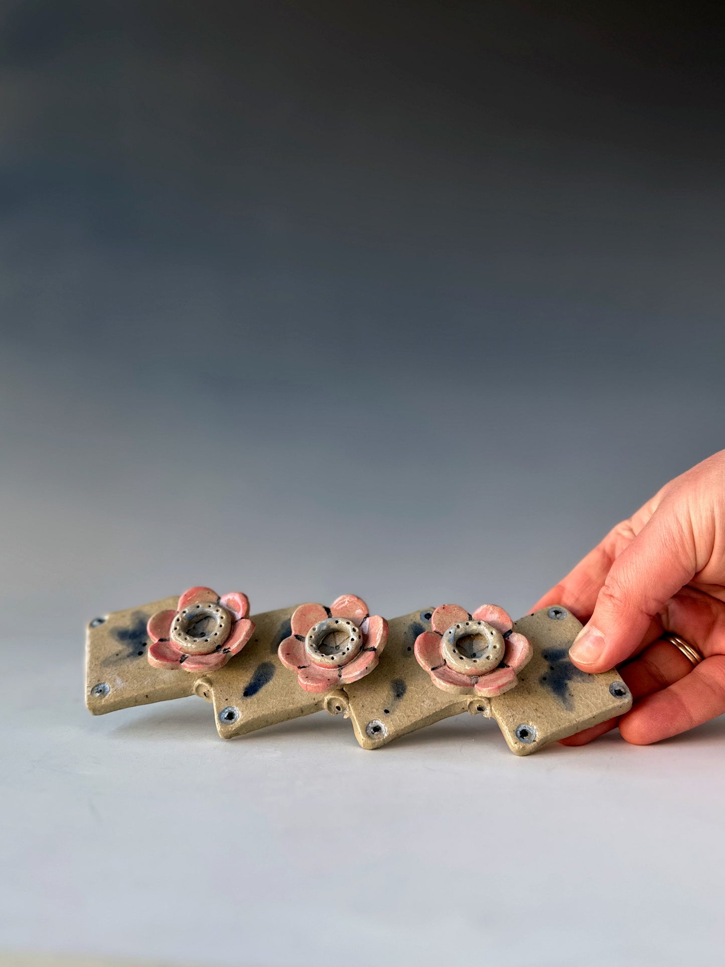 Row of Flowers Candle Holder