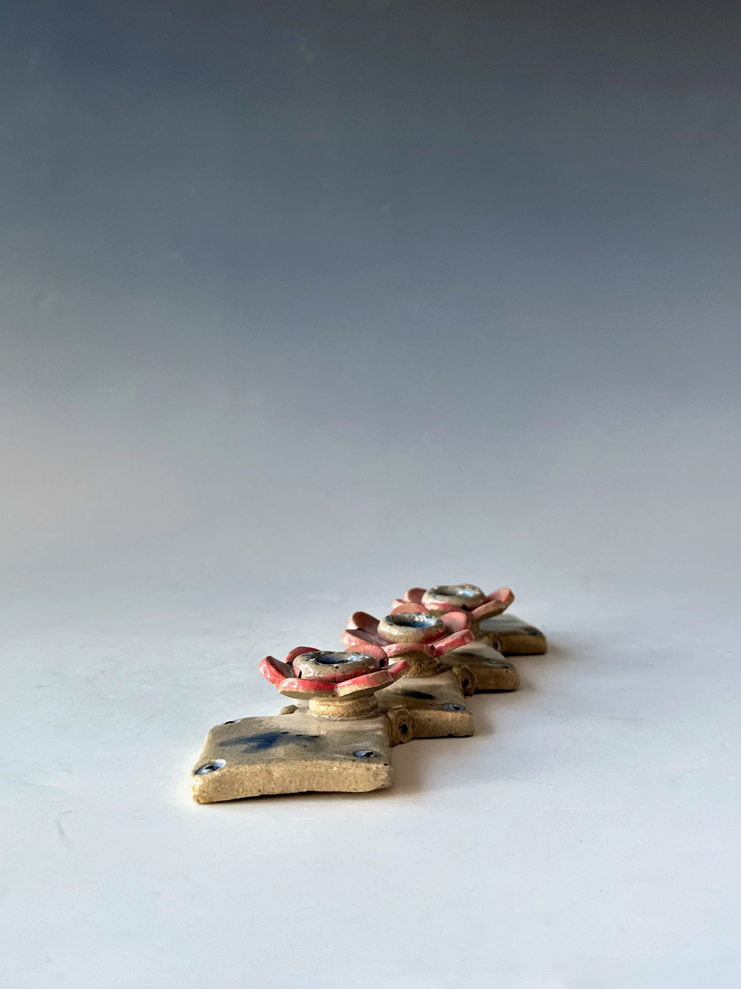Row of Flowers Candle Holder
